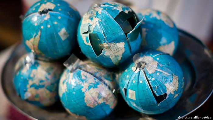 Damaged globes lie on a tray (Picture: O. Spata/dpa).